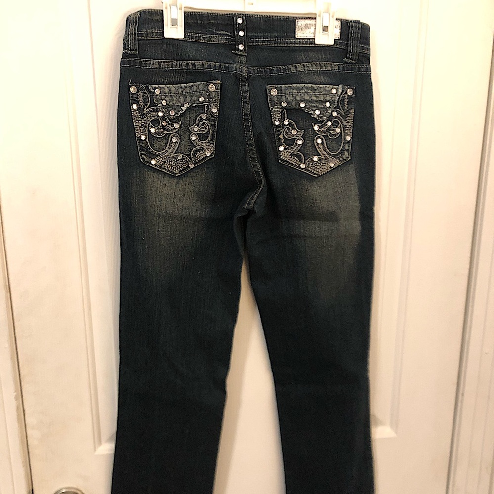 Rich cow jeans with beautiful jeweled pockets.